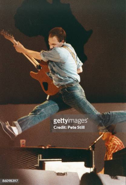 Photo of LIVE AID and Pete TOWNSHEND and The Who, Pete Townshend performing live onstage at Live Aid, jumping in air
