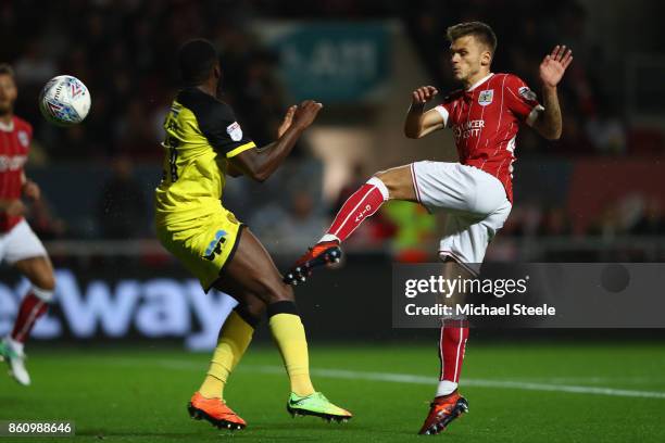 Jamie Paterson of Bristol City has a shot blocked by Hope Akpan of Burton during the Sky Bet Championship match between Bristol City and Burton...
