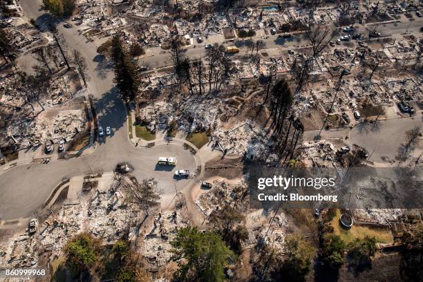 Residences burned by wildfires are seen in this aerial photograph taken above Santa Rosa, California, U.S., on Thursday, Oct. 12, 2017. Wildfires...