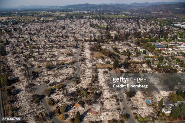 Residences burned by wildfires are seen in this aerial photograph taken above Santa Rosa, California, U.S., on Thursday, Oct. 12, 2017. Wildfires...