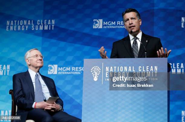 Nevada Gov. Brian Sandoval speaks alongside Former U.S. Senator Harry Reid during the National Clean Energy Summit 9.0 on October 13, 2017 in Las...