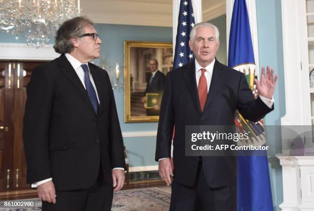 Secretary of State Rex Tillerson poses with Organization of American States Secretary General Luis Almagro before their meeting on October 13,2017 at...