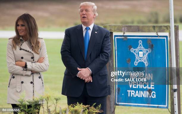 President Donald Trump and First Lady Melania Trump watch a vehicle demonstration at the United States Secret Service James J. Rowley training...