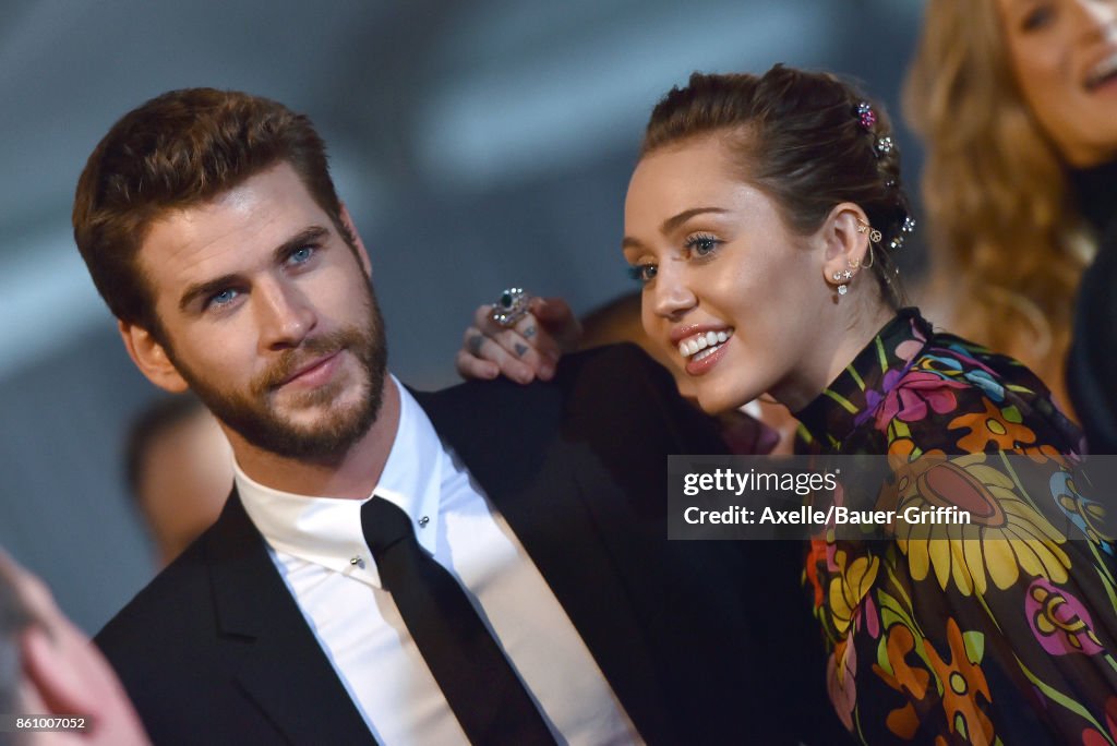 Actor Liam Hemsworth and singer Miley Cyrus arrive at the premiere of