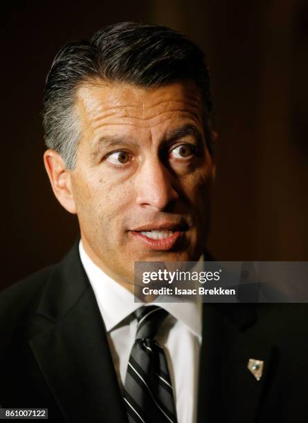 Nevada Gov. Brian Sandoval speaks members of the media during the National Clean Energy Summit 9.0 on October 13, 2017 in Las Vegas, Nevada.