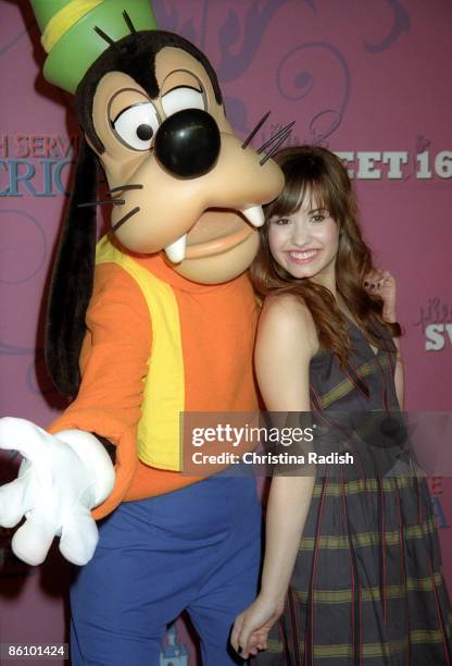 Photo of Demi LOVATO, Portrait of Demi Lovato with Goofy at Miley Cyrus' 16th birthday party