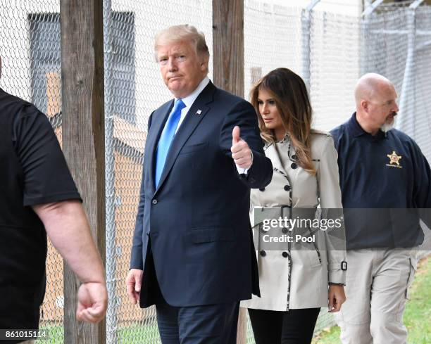 United States President Donald J. Trump acknowledges the press pool as he and first lady Melania Trump tour the U.S. Secret Service James J. Rowley...