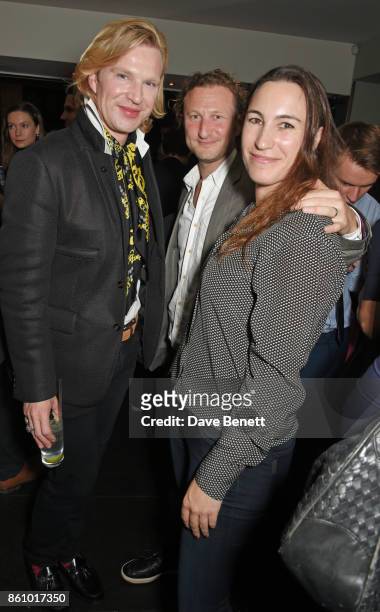 Henry Conway, producer Nick Francis and Cressida Pollock attend the "Walk With Me" party sponsored by Martin Millers Gin at The Den, 100 Wardour St,...