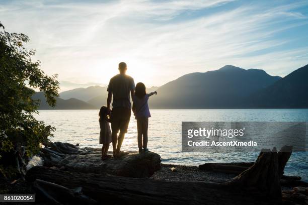 father and daughter connection - british columbia beach stock pictures, royalty-free photos & images