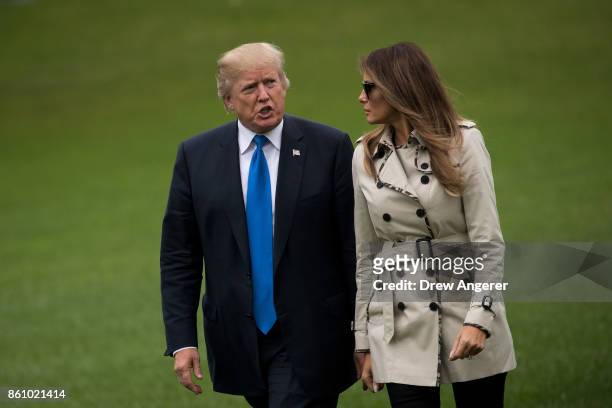 President U.S. President Donald Trump and first lady Melania Trump exit Marine One on the South Lawn of the White House, October 13, 2017 in...
