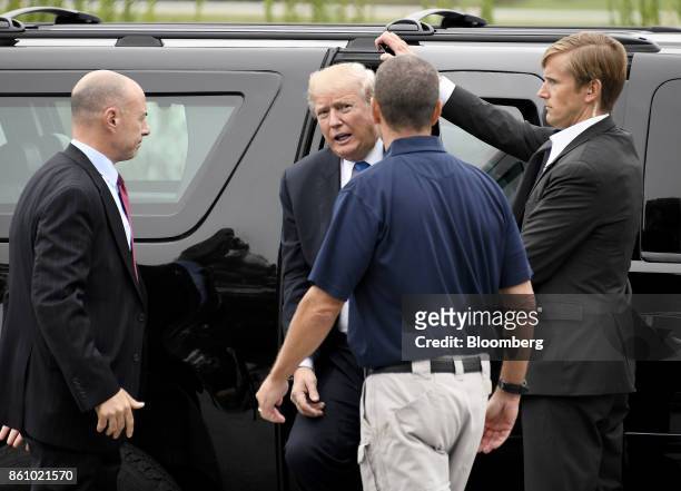 President Donald Trump, center, arrives to tour the U.S. Secret Service James J. Rowley Training Center in Beltsville, Maryland, U.S., on Friday,...