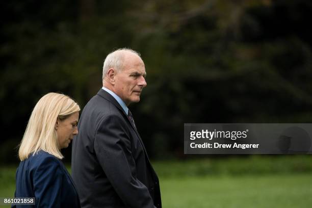 Kirstjen Nielsen, President Trump's nominee to be the next Department of Homeland Security secretary, walks with White House Chief of Staff John...