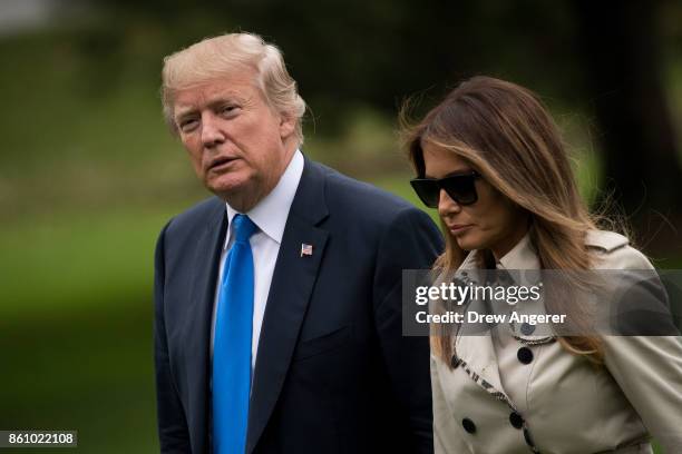 President U.S. President Donald Trump and first lady Melania Trump exit Marine One on the South Lawn of the White House, October 13, 2017 in...