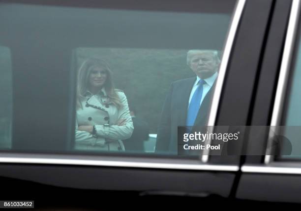 President Donald Trump and First lady Melania Trump are framed through the window of the limousine that was used by United States President Bill...