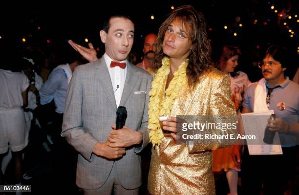 Comedian & actor Paul Reubens , as his character Pee-Wee Herman, and singer David Lee Roth pose together at the premiere of the movie 'Pee-Wee's Big...