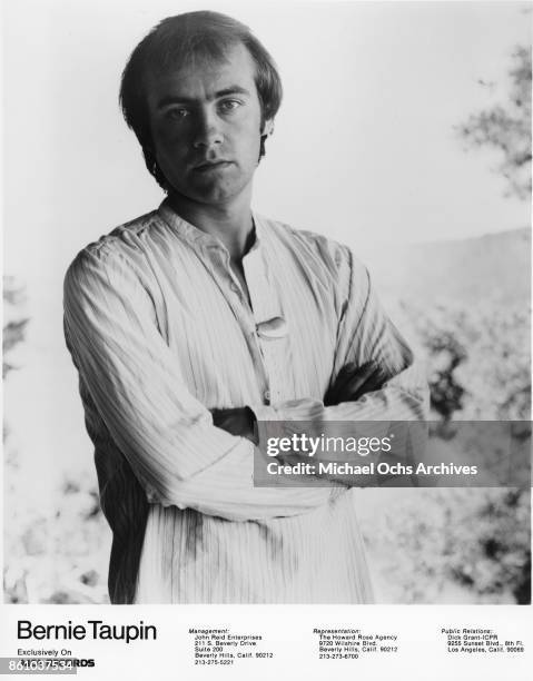 Songwriter Bernie Taupin poses for a portrait in June 1976.