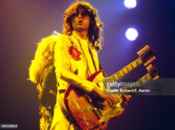 Photo of Jimmy PAGE and LED ZEPPELIN, Jimmy Page performing live onstage during the 1977 US tour , playing Gibson EDS-1275 twin-neck/double-neck...