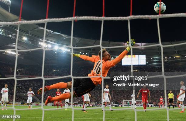 Dominique Heintz of Koeln scores his team's first goal past goalkeeper Ron-Robert Zieler of Stuttgart during the Bundesliga match between VfB...