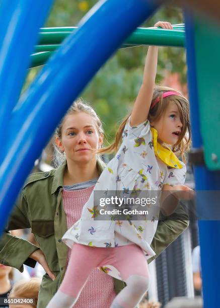 Sienna Miller and daughter Marlowe Sturridge are seen on October 13, 2017 in New York City.