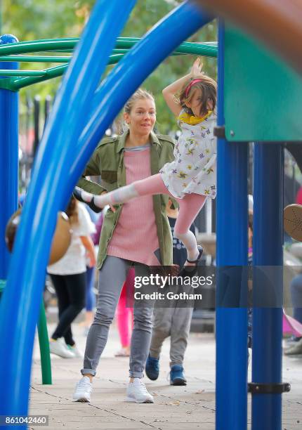 Sienna Miller and daughter Marlowe Sturridge are seen on October 13, 2017 in New York City.