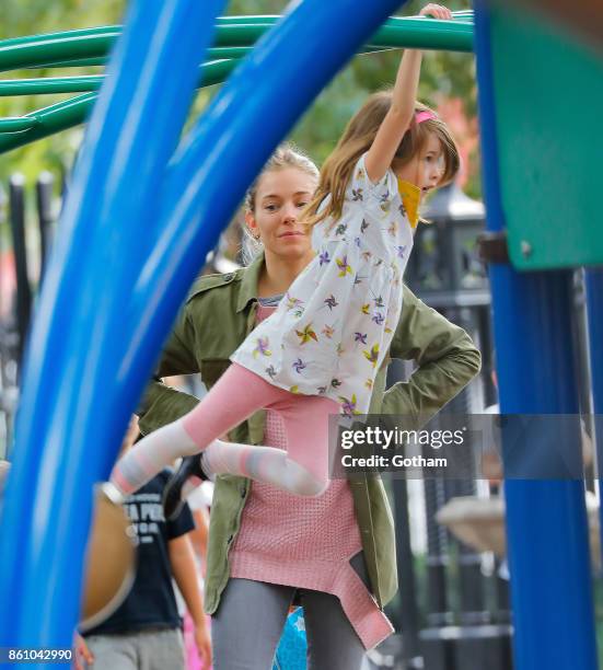 Sienna Miller and daughter Marlowe Sturridge are seen on October 13, 2017 in New York City.