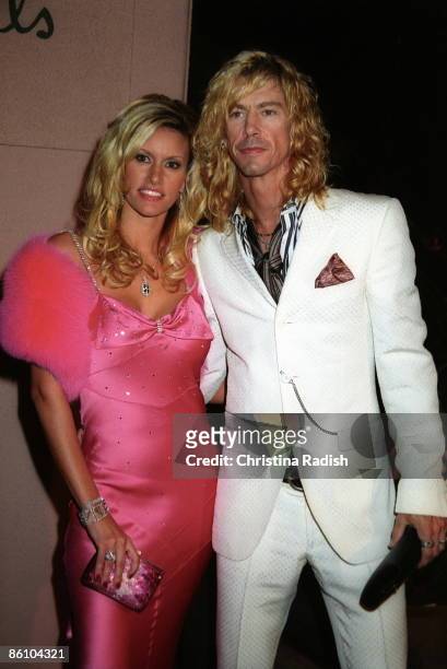 Photo of Duff McKAGAN; Velvet Revolver bass player Duff McKagan with his wife Susan Holmes at the Clive Davis pre-Grammy party held at the Beverly...