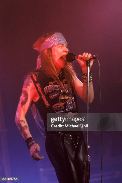 Photo of Axl ROSE and GUNS N' ROSES and GUNS & ROSES and GUNS AND ROSES, Axl Rose performing live onstage, wearing Harley Davidson t-shirt