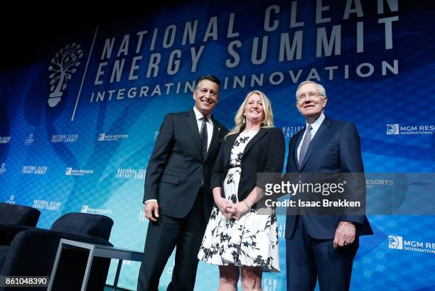 Nevada Gov. Brian Sandoval, Executive Director of Clean Energy Project Karen Wayland and Former U.S. Senator Harry Reid pose for photos following the...