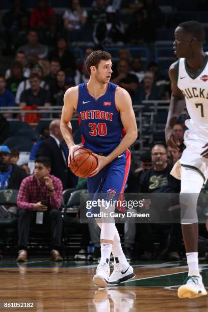 Milwaukee, WI Jon Leuer of the Detroit Pistons handles the ball against the Milwaukee Bucks on October 13, 2017 at the BMO Harris Bradley Center in...