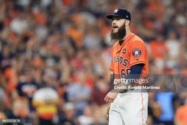Dallas Keuchel of the Houston Astros reacts after striking out Aaron Judge of the New York Yankees to end the top of the third inning during game one...