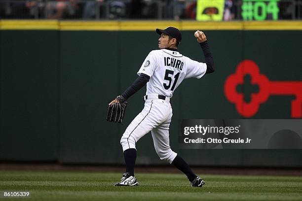 Ichiro Suzuki of the Seattle Mariners throws against the Detroit Tigers during the game on April 18, 2009 at Safeco Field in Seattle, Washington.