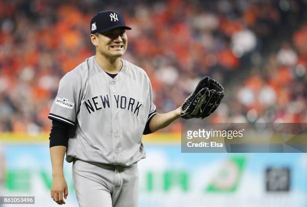 Masahiro Tanaka reacts after hitting Gary Sanchez of the New York Yankees in the leg with a pitch in the third inning against the Houston Astros...