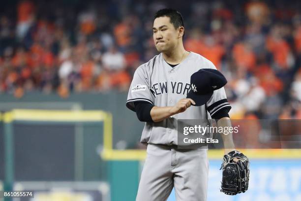 Masahiro Tanaka of the New York Yankees reacts against the Houston Astros during game one of the American League Championship Series at Minute Maid...