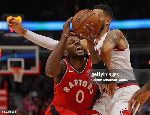 Miles of the Toronto Raptors tries to drive against Denzel Valentine of the Chicago Bulls during a preseason game at the United Center on October 13,...