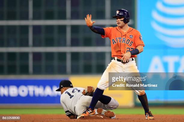 Jose Altuve of the Houston Astros steals second against Starlin Castro of the New York Yankees in the fourth inning during game one of the American...
