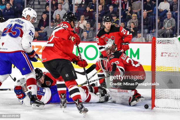 Goaltender Mackenzie Blackwood of the Binghamton Devils loses sight of the puck against the Laval Rocket during the AHL game at Place Bell on October...