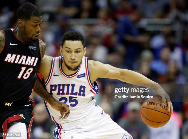 Ben Simmons of the Philadelphia 76ers drives as DeAndre Liggins during the game at Sprint Center on October 13, 2017 in Kansas City, Missouri.