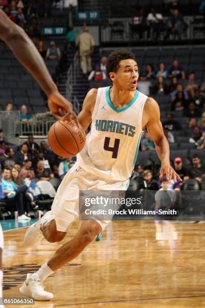 Marcus Paige of the Charlotte Hornets handles the ball against the Dallas Mavericks on October 13, 2017 at Spectrum Center in Charlotte, North...