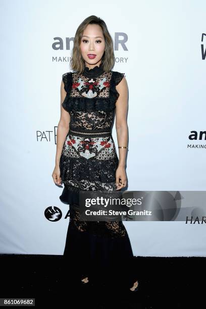 Fashion and interior design blogger Aimee Song attends the amfAR Gala 2017 at Ron Burkle's Green Acres Estate on October 13, 2017 in Beverly Hills,...