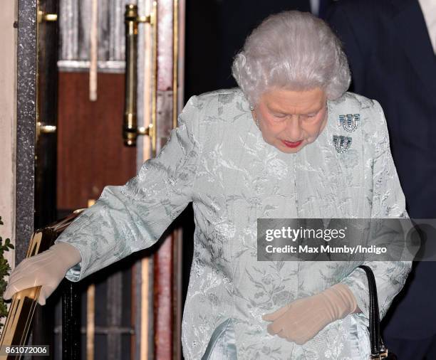 Queen Elizabeth II departs after attending a reception to mark the Centenary of the Women's Royal Navy Service and the Women's Auxiliary Army Corp at...