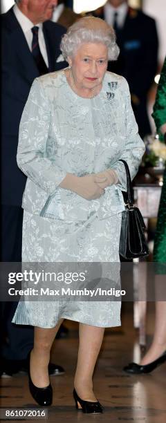 Queen Elizabeth II departs after attending a reception to mark the Centenary of the Women's Royal Navy Service and the Women's Auxiliary Army Corp at...