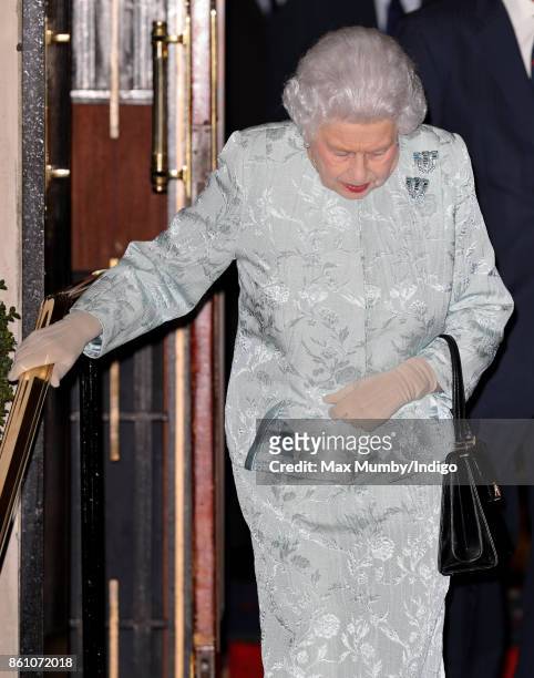 Queen Elizabeth II departs after attending a reception to mark the Centenary of the Women's Royal Navy Service and the Women's Auxiliary Army Corp at...