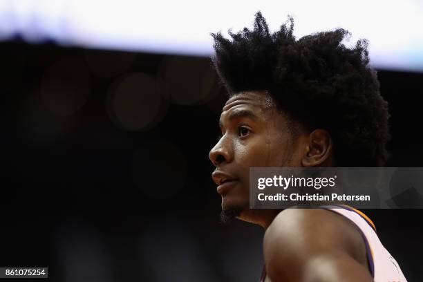 Josh Jackson of the Phoenix Suns stands on the court during the first half of the NBA preseason game against the Brisbane Bullets at Talking Stick...