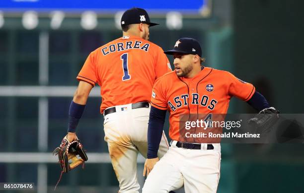 Carlos Correa and Lance McCullers Jr. #43 of the Houston Astros celebrate their 2 to 1 win over the New York Yankees during game one of the American...