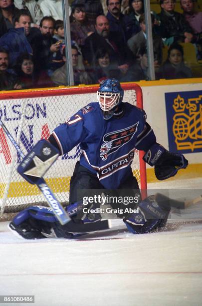 Olaf Kolzig of the Washington Capitals skates against the Toronto Maple Leafs during NHL game action on November 10, 1995 at Maple Leaf Gardens in...