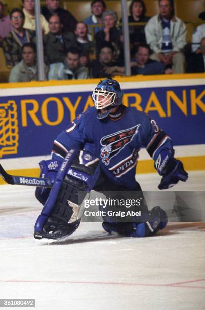 Olaf Kolzig of the Washington Capitals skates against the Toronto Maple Leafs during NHL game action on November 10, 1995 at Maple Leaf Gardens in...