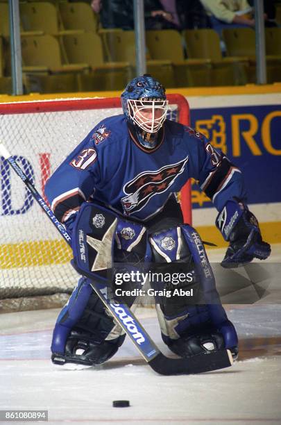 Olaf Kolzig of the Washington Capitals skates against the Toronto Maple Leafs during NHL game action on November 10, 1995 at Maple Leaf Gardens in...