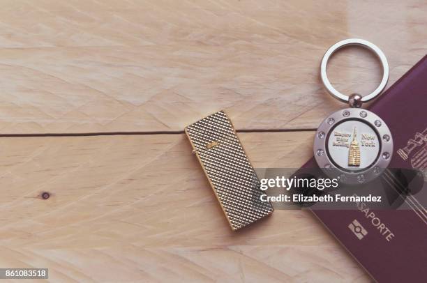 close-up of a lighter and keychain souvenir from new york city - keyring charm stock pictures, royalty-free photos & images