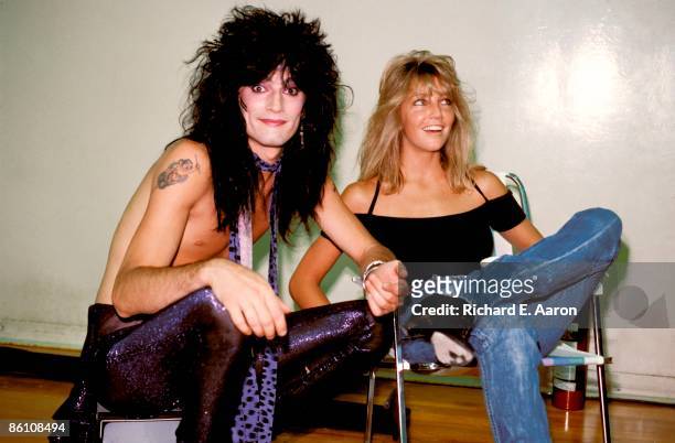 Tommy Lee of Motley Crue poses backstage with wife Heather Locklear.