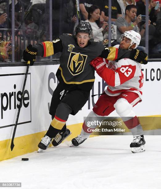 Brendan Leipsic of the Vegas Golden Knights skates with the puck behind the net against Trevor Daley of the Detroit Red Wings during their game at...